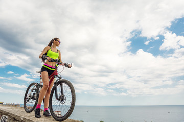 Fototapeta premium A beautiful girl on the bike