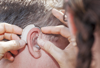 Hearing aid inserting
