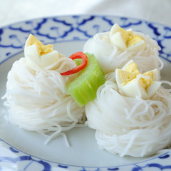 Fermented Rice Flour Noodles in classic plate with eggs