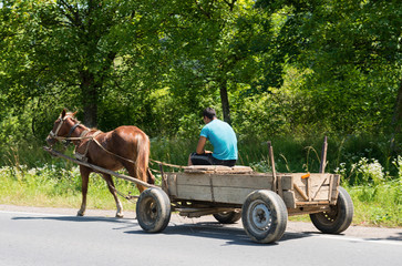 Man and old wooden cart