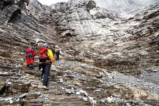 Alpinist climbing Eiger Peak, Berner Oberland, Switzerland - UNESCO Heritage