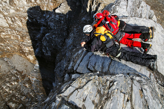 Alpinist climbing Eiger Peak, Berner Oberland, Switzerland - UNESCO Heritage