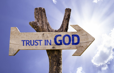 Trust in God wooden sign on a beautiful day - obrazy, fototapety, plakaty
