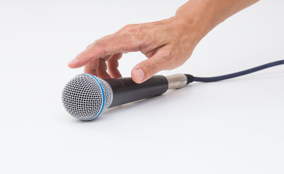 Hand Grabbing Microphone On White Background