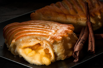 Apple pastry with raisins and cinnamon golden crust dark