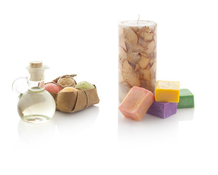 Spa oil in bottles with scented candles and soaps. With PS paths