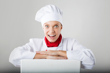 Chef Sign. Woman cook looking over paper sign billboard.