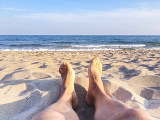 man legs on the beach