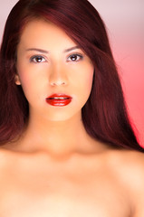 Young beautiful woman with red hair