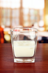 Tasty creamy liquor, on bright background