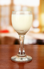 Tasty creamy liquor, on bright background