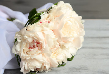 Beautiful wedding bouquet on  color wooden background