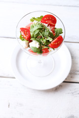 Salad with watermelon, feta cheese, arugula, tomatoes, sesame