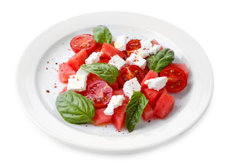 Salad with watermelon, feta and basil leaves