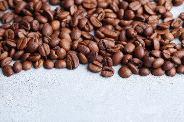 Coffee beans on color wooden background
