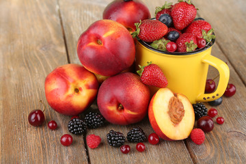 Peaches and berries on table close-up