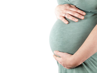 Pregnant young woman holding her belly