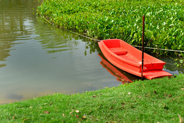 orange boat in lake