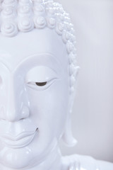 The beautiful face of white Buddha image