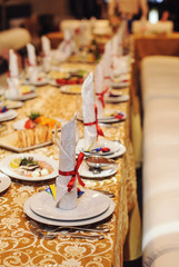Table setting with red ribbon