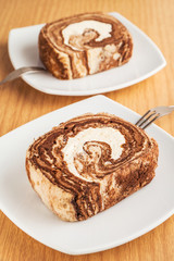 Chocolate roll cake on plate