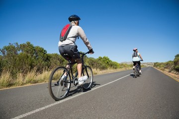 Active couple going for a bike ride in the countryside