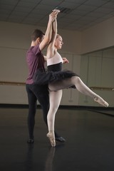 Ballet partners dancing gracefully together