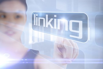 Businesswoman pointing to word linking