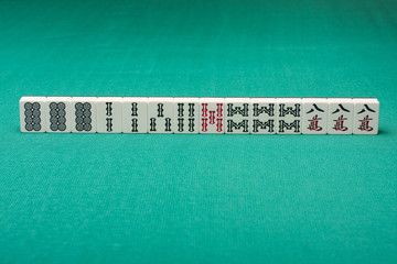 Smooth table surface with a mahjong on it
