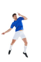 Naklejka na ściany i meble Football player in blue jersey jumping