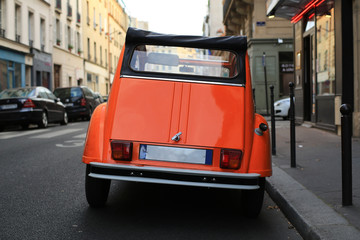 Fototapeta na wymiar Retro car orange color purity in the street