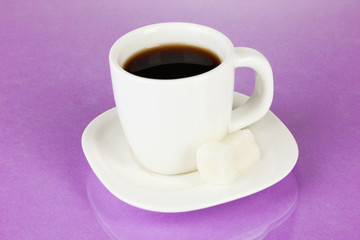 A cup of strong coffee on purple background