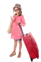 little girl with a red suitcase talking on phone