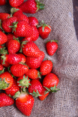 Ripe sweet strawberries on sackcloth  background