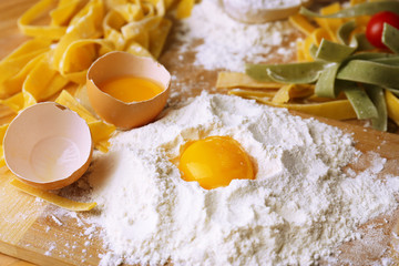 Still life with raw homemade pasta and ingredients for pasta