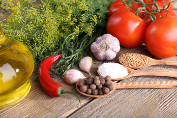 Fresh vegetables with herbs and spices on table, close-up