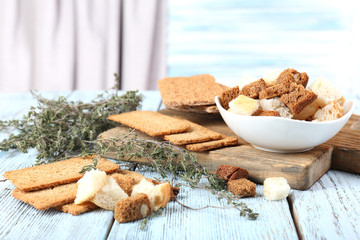 Homemade croutons on table in kitchen, close up