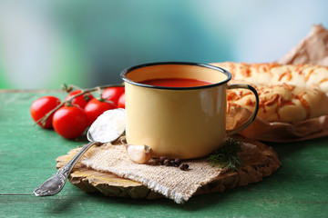 Homemade tomato juice in mug, spices and fresh tomatoes