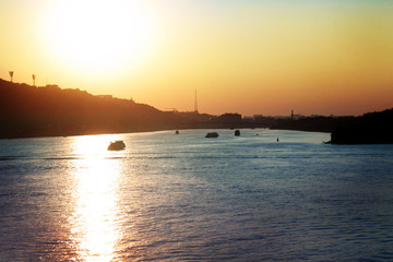 Naklejka premium Evening landscape with river and boats