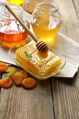 Fresh honey on wooden table