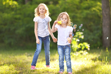 Portrait of two girls in the woods girlfriends