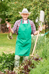 Portrait of proud farmer with ripe beet 