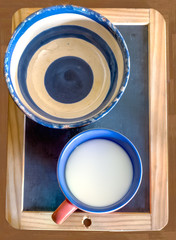 pottery bowl and cup milk on blackboard