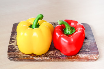 Yellow and red bell peppers (Sweet pepper or capsicum) on old ch