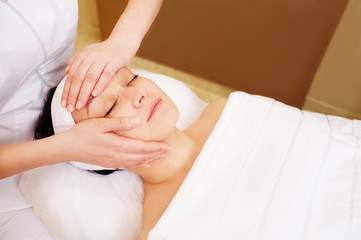 Facial treatment with professional massage of cosmetician