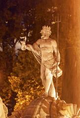 Naklejka premium Neptune Statue Fountain Night Madrid Spain