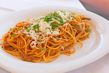  Vegetarian spaghetti with cheese on a white plate