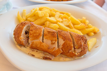  Chicken roll stuffed with vegetables with white sauce and frenc