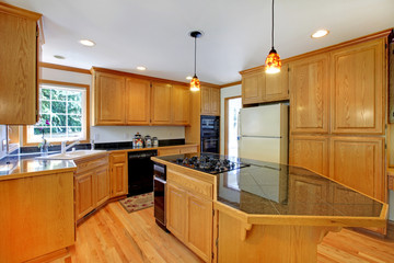 Large traditional wood golden kitchen.
