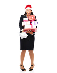 Business woman with santa claus hat is holding parcels